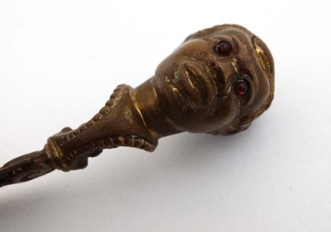 A late 19thC / early 20thC brass book mark / page mark surmounted by the head of a negro male with - Image 2 of 4