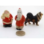 Three vintage cake decorations to include two c1950s Christmas painted plaster Santa Claus cake