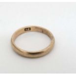 A childs yellow metal ring CONDITION: Please Note - we do not make reference to