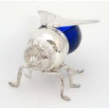 A late 20thC / early 21stC novelty honey pot formed as a bee with blue glass body and silver plated