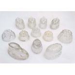 A quantity of assorted glass jelly / blancmange moulds many with lobed decoration,