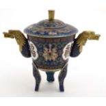 A Chinese Cloisonne gilt lidded three footed vessel with dragon head handles 4 1/4" high