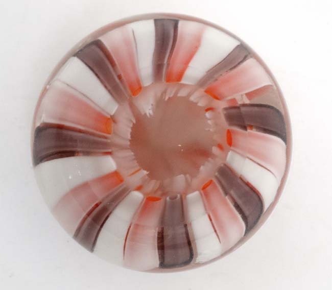 A glass paperweight with banded pink and white decoration approx 3" diameter CONDITION: - Image 2 of 3