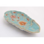 A Chinese dish of shell form decorated to top with red bats, ,