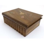 An olive wood book form needlework box with inlaid needles,