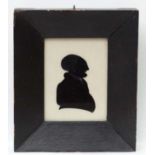 Reverse glass Silhouette : A hand painted image of an early Victorian gentleman with highlights,