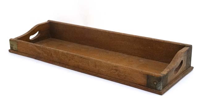 An early 20thC blonde oak desk top book trough / tray with two pierced carry handles and brass - Image 2 of 5