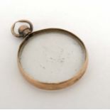 A 9ct gold pendant with glazed central locket section approx.