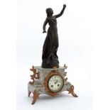 French marble clock : a green flecked marble cased 8 day clock surmounted by a sculpture after