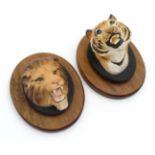 A Beswick lion's head wall plaque , number 2933 and a Beswick Tiger's head wall plaque ,