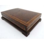 A 19thC burr yew wood and mahogany strung hinged lidded box 15" wide x 11" deep x 3 1/4" high