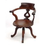 A Victorian walnut swivel open arm office chair 32 1/2" high CONDITION: Please Note