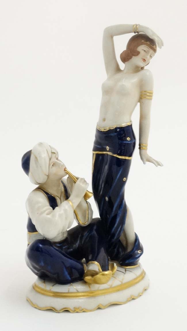 A Royal Dux Art Deco figure group depicting a half naked female in exotic dance pose while a - Image 3 of 6