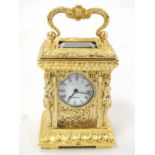 20thC gilded brass Rococo Mini carriage Clock : an ornate cast and chaste two bevelled glass