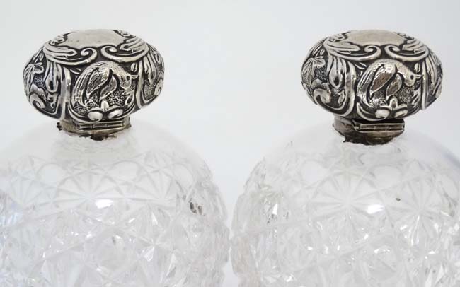 A pair of cut glass scent bottle of spherical form with silver tops hallmarked Chester 1904 maker - Image 5 of 5