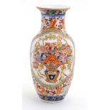 An oriental baluster-shaped vase, enamel-painted with floral bouquets.