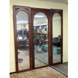 A set of 3 tall arched top mirrors, formerly used as bar mirrors.