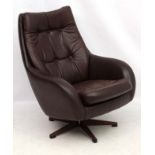 Vintage Retro : a Swedish Swedfurn brown leather swivel button back armchair with five spoke base,