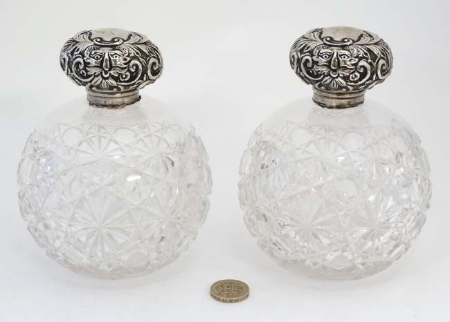 A pair of cut glass scent bottle of spherical form with silver tops hallmarked Chester 1904 maker - Image 4 of 5
