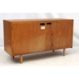 Vintage Retro : A British university 2 door cabinet on turned shaped legs,