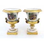 A pair of hand painted Sevres ? twin handled campagna urns,