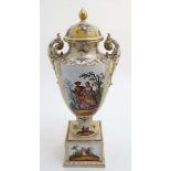 An Austria porcelain twin handled urn vase and cover on stand,