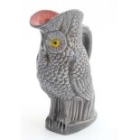 A majolica style grey owl jug / pitcher, having pink interior, marked under 0960.