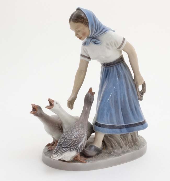 A Dahl Jensen Copenhagen '' Goose Girl '' figurine , number 1296 , bears factory stamp to base.
