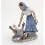 A Dahl Jensen Copenhagen '' Goose Girl '' figurine , number 1296 , bears factory stamp to base.