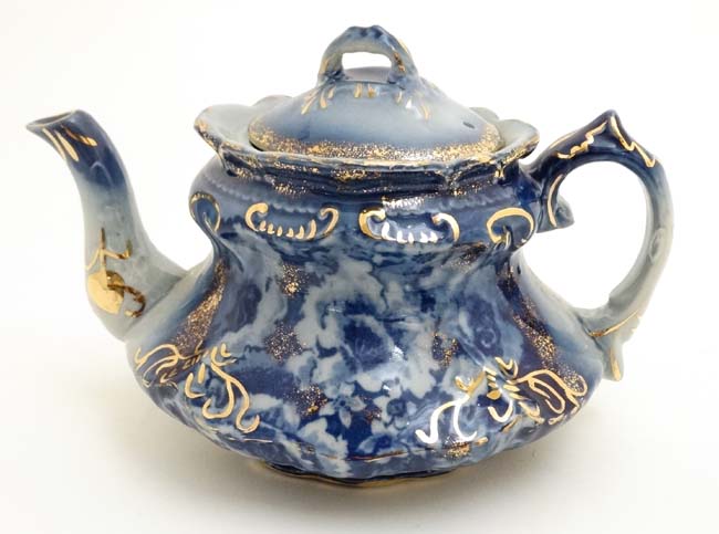 An early 20thC flo blue (flow blue) T Rathbone and Co , Victor teapot ,