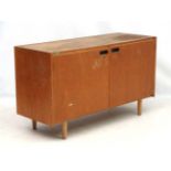 Vintage Retro : A British university 2 door cabinet on turned shaped legs,