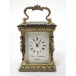 A 19thC Gilt brass ' Chas Frodsham ' Carriage Clock : an ornate cast and chased 5 bevelled glass