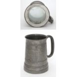 Pewter tankard with glazed base containing pair of dice CONDITION: Please Note -