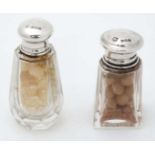 2 small glass salts bottles with silver tops hallmarked Birmingham 1931 maker W J Myatt & Co The