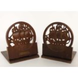 A pair of folding teak bookends marked ' From the teak of HMS iron duke admirals Jellicoe's
