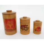 Militaria : A nest of three turned wooden graduated canisters ,