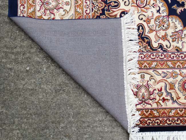 Carpet / Rug: A machine made Persian Keshan style carpet with midnight blue / black central - Image 3 of 7