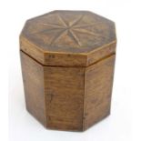 A Georgian mahogany octagonal caddy box inlaid with 8-point star to top with blue paper lined lid