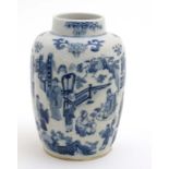 A small Chinese blue and white tea caddy decorated with figures on a verandah and decorative bamboo