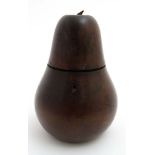 A 19thC tea caddy in the form of a large pear with hinged lid and having bow shaped lock within and