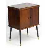 Vintage Retro : a mid century Oak cased 2 door record cabinet on turned tapering ebonised legs with