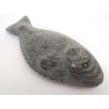 Inuit : A carved soapstone depiction of a flat fish.