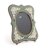 A mid 20thC Italian micro mosaic easel / strut back picture frame with glazed oval to centre.