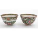 A pair of Canton enamel painted bowls, one decorated with shou characters and peaches,