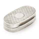 A Victorian silver snuff box of oval form with engine turned decoration.