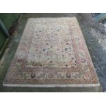 Carpet / rug : A Large machine made woollen carpet , with buff central ground,