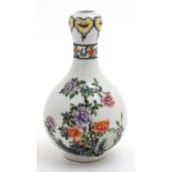 A Chinese famille rose Suantouping vase decorated with Chrysanthemums on a rocky outcrop with