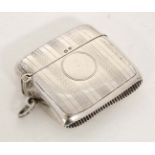 A silver vesta case with engraved decoration. Hallmarked Birmingham 1919 maker F H Adams Ltd.