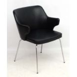 Vintage Retro : A Danish black vinyl and chrome four legged elbow chair,