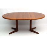 Vintage Retro : a Danish Teak pedestal table , extending with one leaf to part the pedestal ,